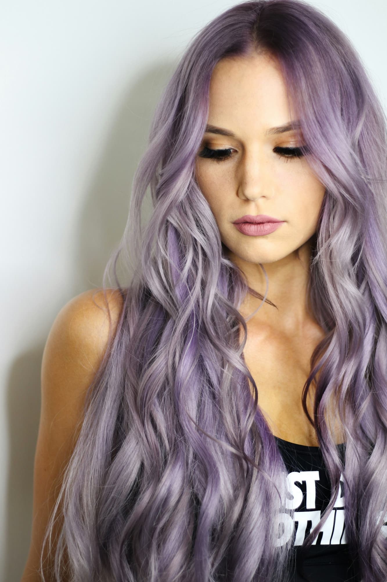 Woman with long wavy lavender-toned hair